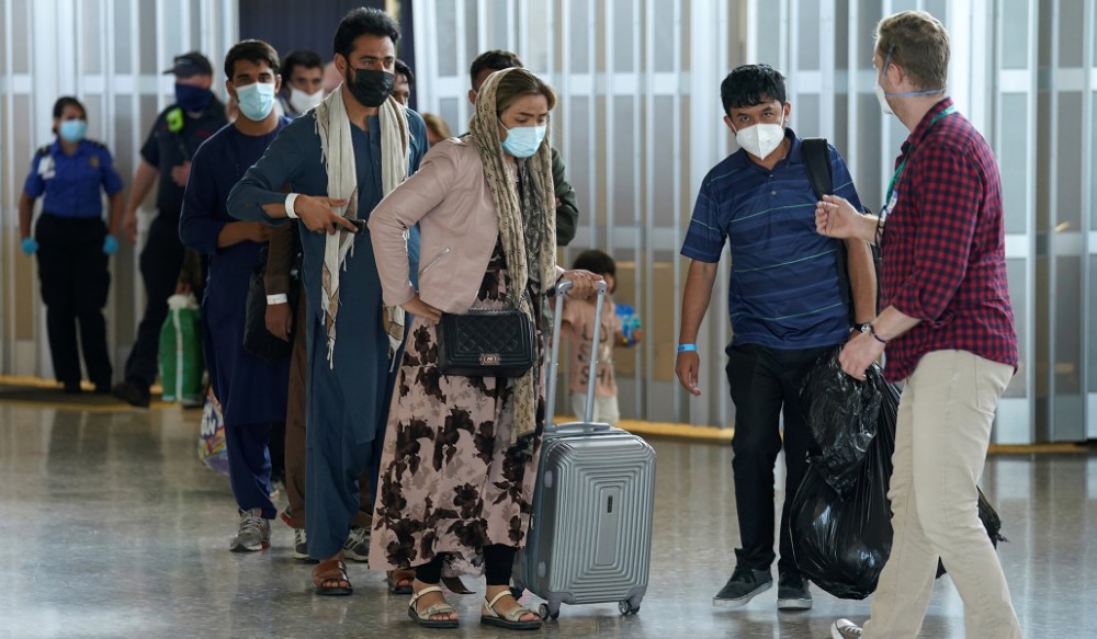 Afghan refugees arrive at Dulles Airport in Virginia